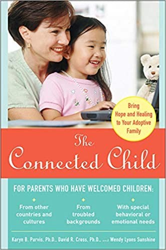 book cover of The Connected Child by Dr. Karyn Purvis.  The cover photo is a mom sitting a desk smiling with her young daughter sitting on her lap. 